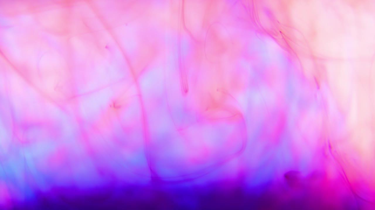 Color vivid paint ink drops in water inky cloud swirling smoke alpha.