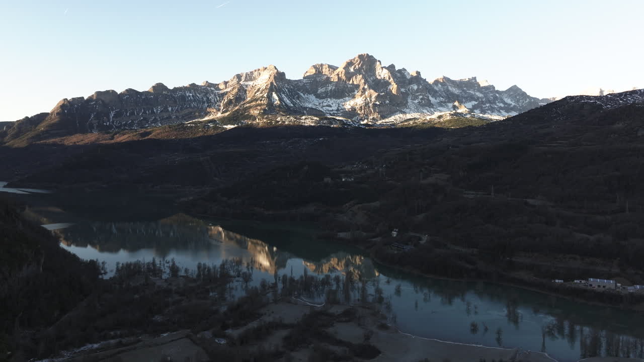 Snowy Mountain Range with Alpine Lake
