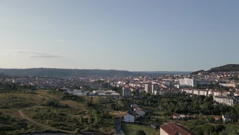 blue sky flyover: low mountains seen outside city of ourense, spain