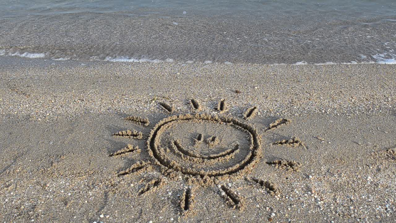Sun drawing on the beach. Beach and drawing