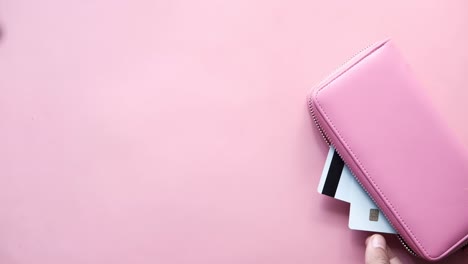 pink wallet with credit cards