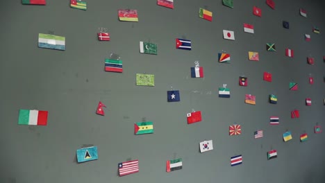 collection of world flags on a wall