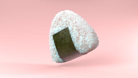 onigiri rice ball wrapped in nori seaweed on pink background.