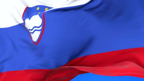 slovenia flag waving at wind in slow in blue sky, loop