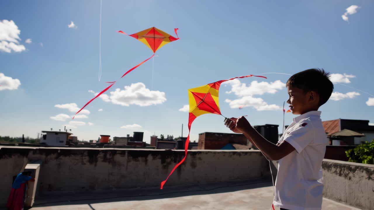 A young boy flies a colorful kite on a sunny day.