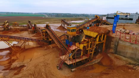 mining equipment at sand mine territory. mining conveyor at sand quarry