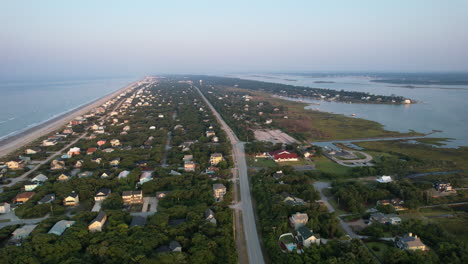 emerald isle in the morning with calm ocean waves, drone aerial shot