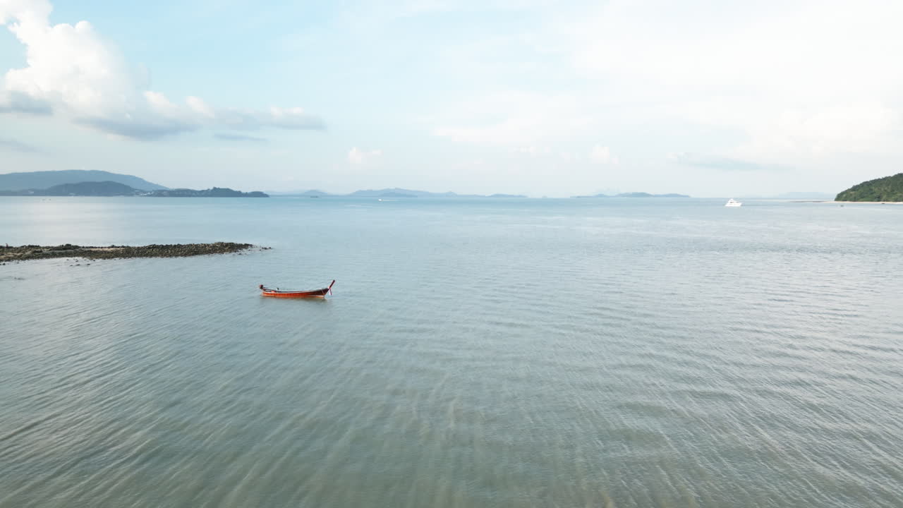 Tranquil Bay Scene with Longtail Boat