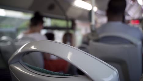 Back-of-a-public-bus-seat-going-through-a-city-in-Malta