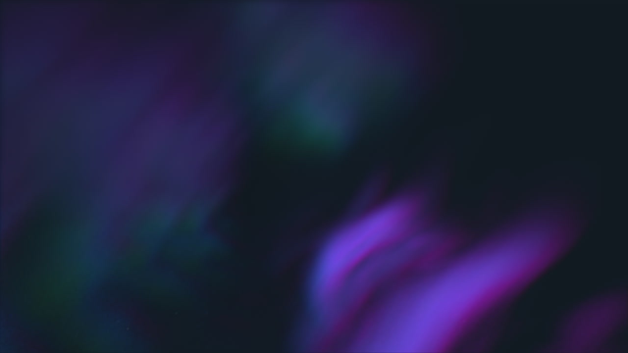 Dynamic shimmering purple and blue light in a dark background