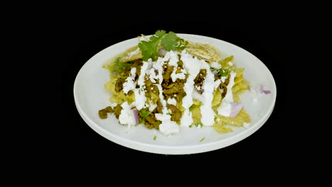 chilaquiles with eggs on a turntable