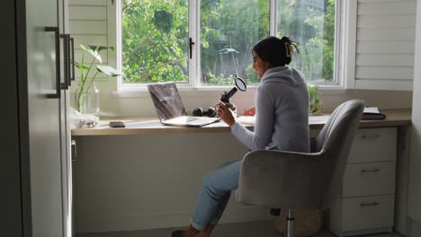 video of biracial woman taking part in online interview on laptop at home