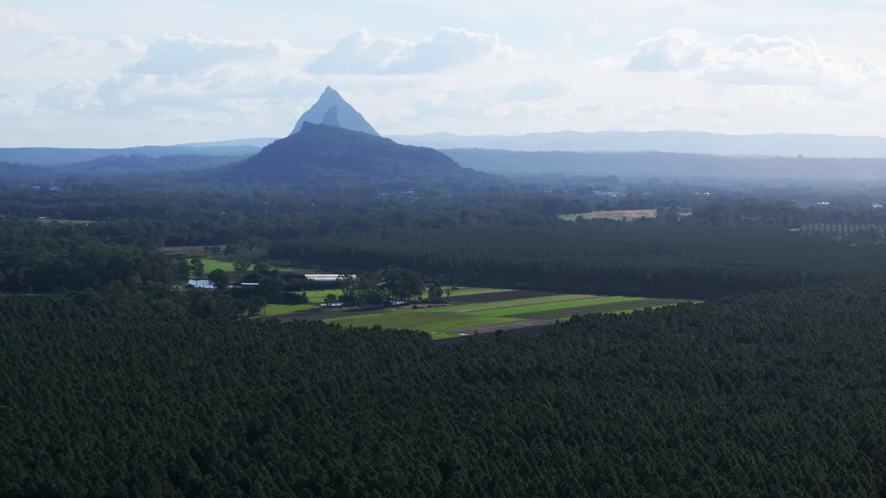 Glass House Mountains Sunshine Coast Queensland QLD Australia aerial drone farm land morning afternoon blue sky sunny clouds Lutton Beerburrum Peachester State bush forest circle left parallax motion
