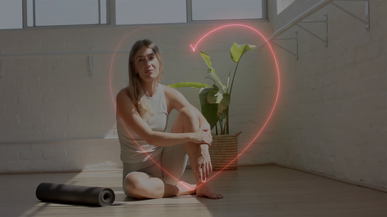 sentada en el suelo con una alfombra de yoga, mujer rodeada de animación cardíaca