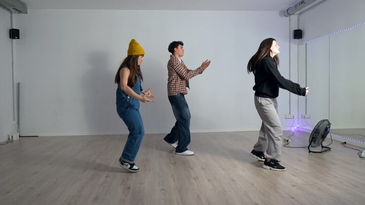 Group of people dancing in a studio