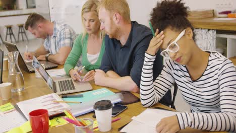 young people working hard in office