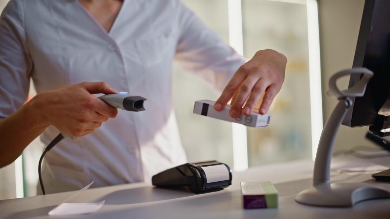 Woman hands scanning medicine pills preparing order selling in drugstore closeup