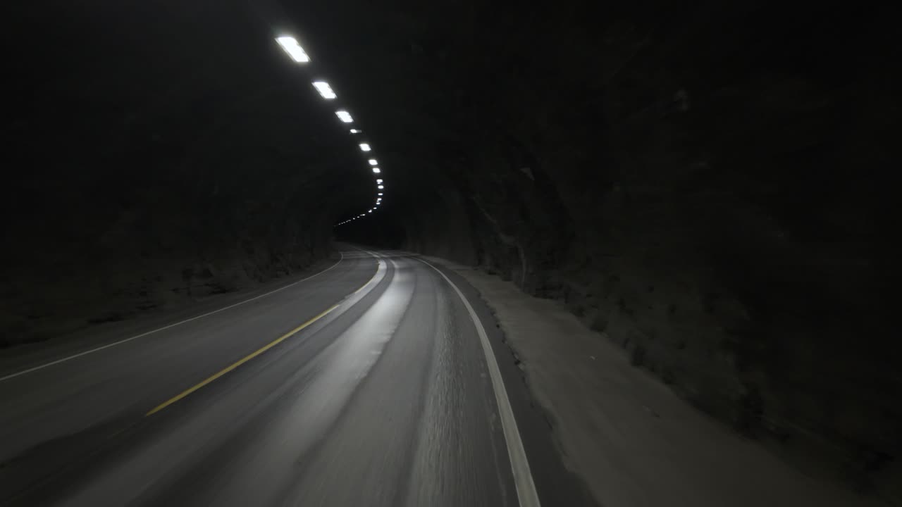 Driving On A Tunnel Road In Norway. POV Shot