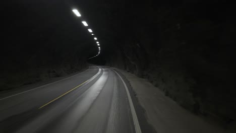driving on a tunnel road in norway. pov shot