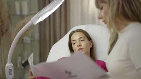 beautician consulting with a client in a modern beauty salon