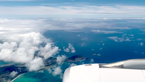 Aerial-View-Of-Honolulu-Hawaii-And-Islands-From-Above-With-Clouds-From-Flying-Airplane-Window