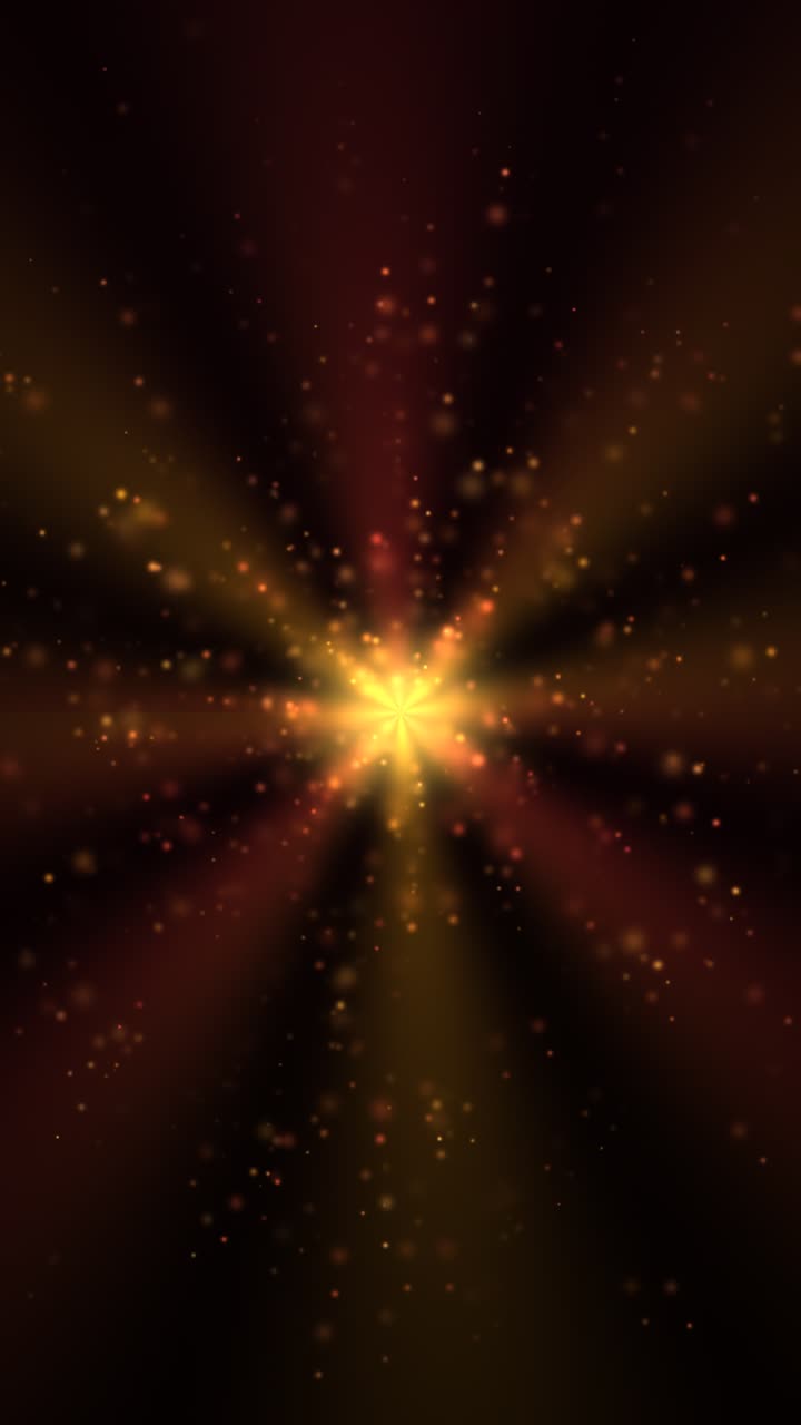 A radiant yellow core emits red and orange rays against a black background, with swirling particles and a subtle bloom effect