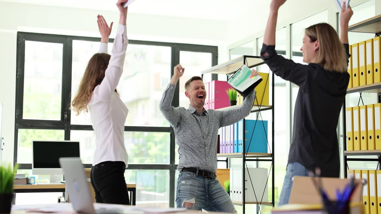 Successful Business Team Celebrating in Office
