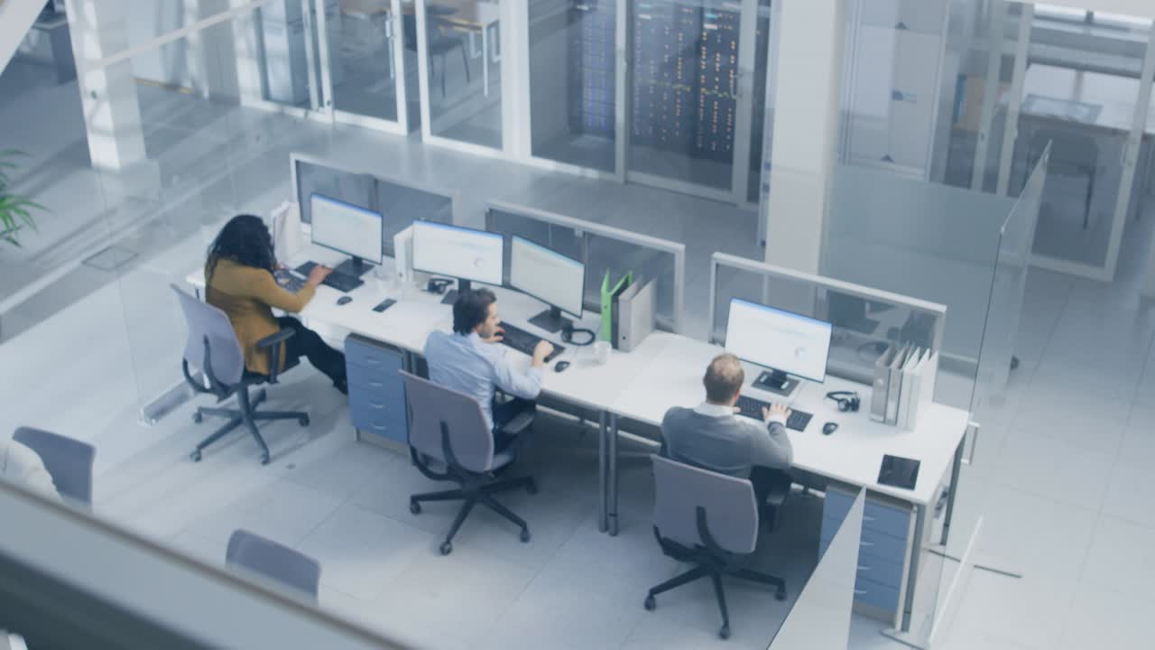 Camera Moving From Businesswoman Using Computer with Graphs and Statistics to People Working at their Desktop Computers on First. Open Space Two Floor Office With Businesspeople and Executive Branch