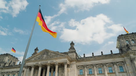 german flag on the reichstag in berlin