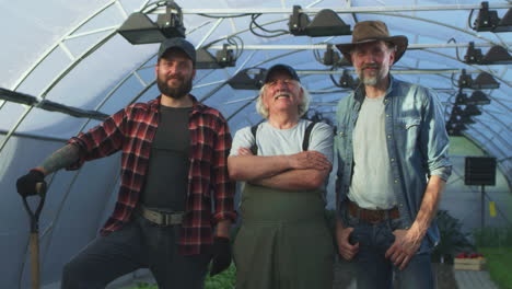 three farmers in a greenhouse