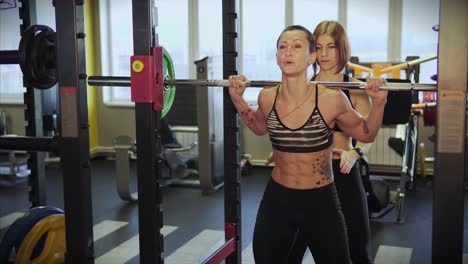 women weightlifting in gym