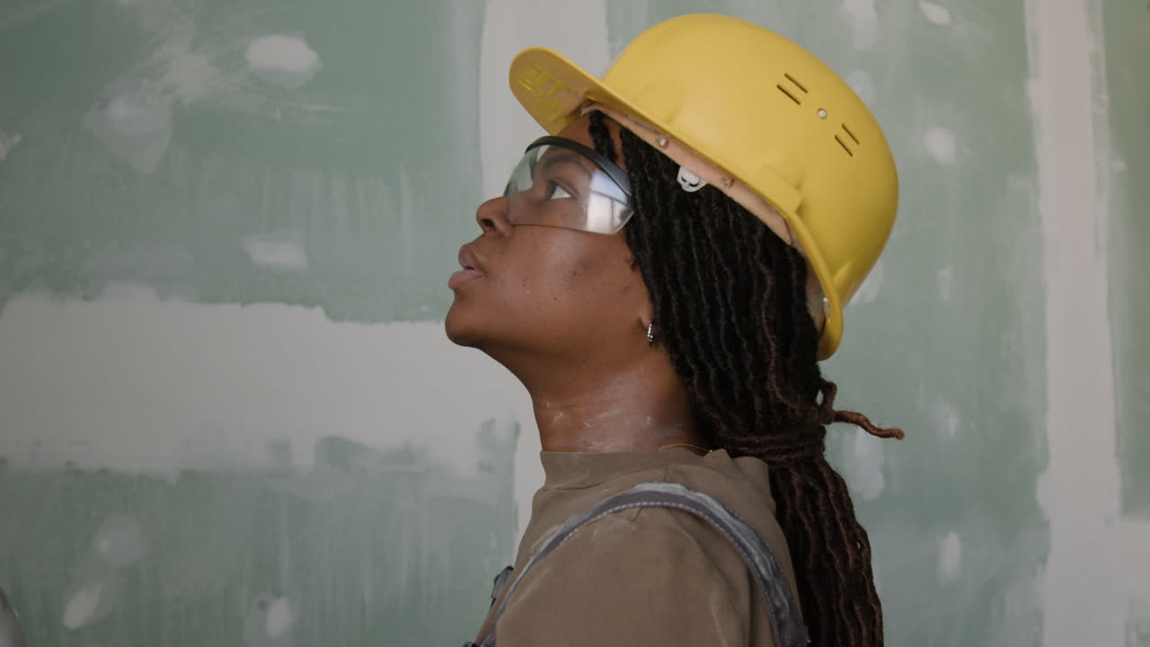 Construction Workers Installing Drywall