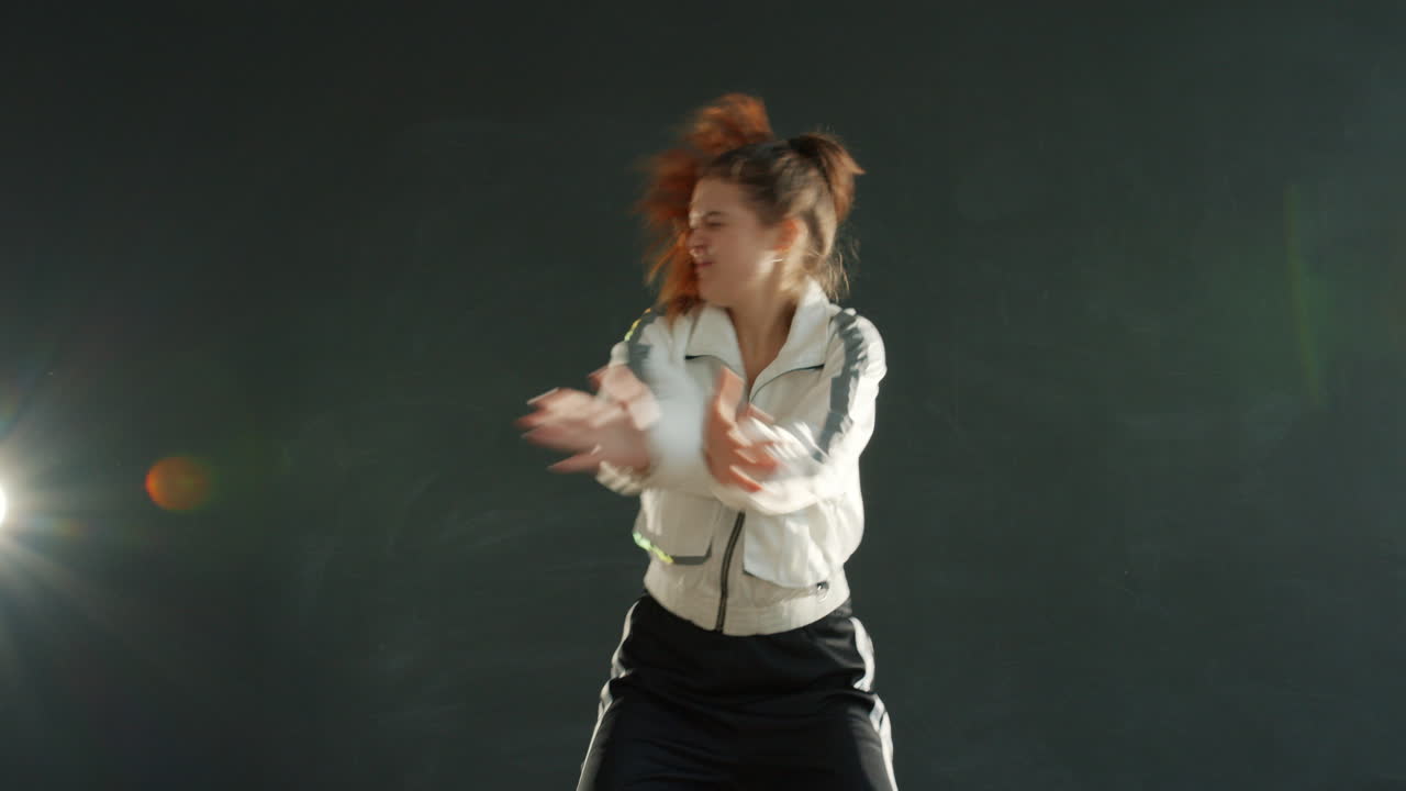 Teenage girl dancing in studio