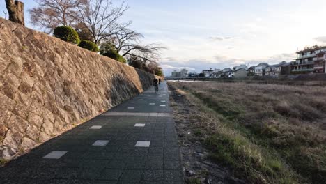 cyclist riding along a scenic path