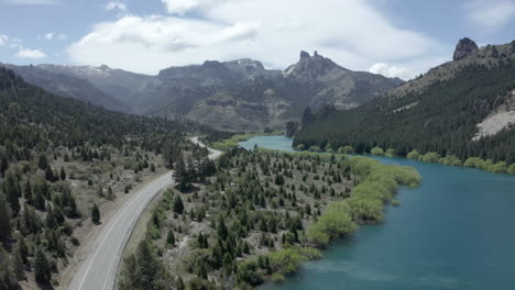 aerial - highway next to limay river in valle encantado, patagonia, neuquen, argentina