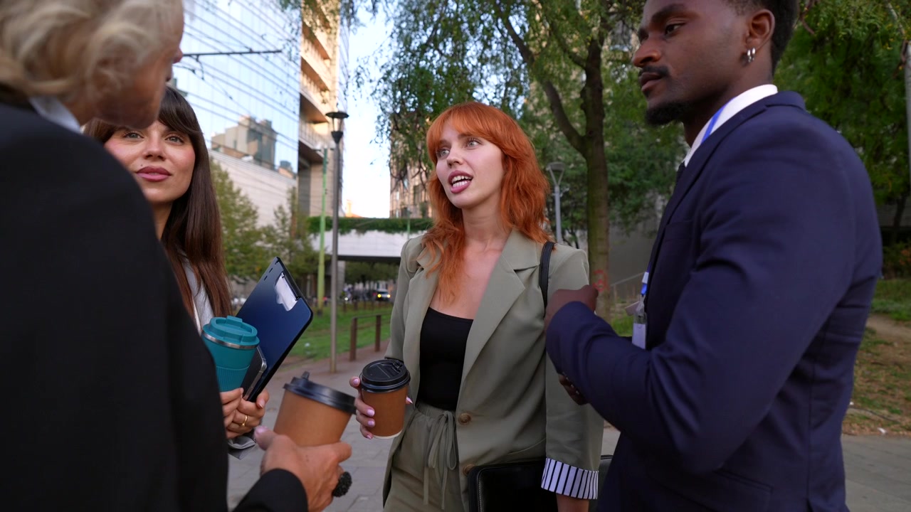 Diverse Group of Professionals Having a Casual Meeting Outdoors