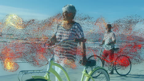 couple walking bicycles along beach shoreline, showing health marketing chart and wave icons