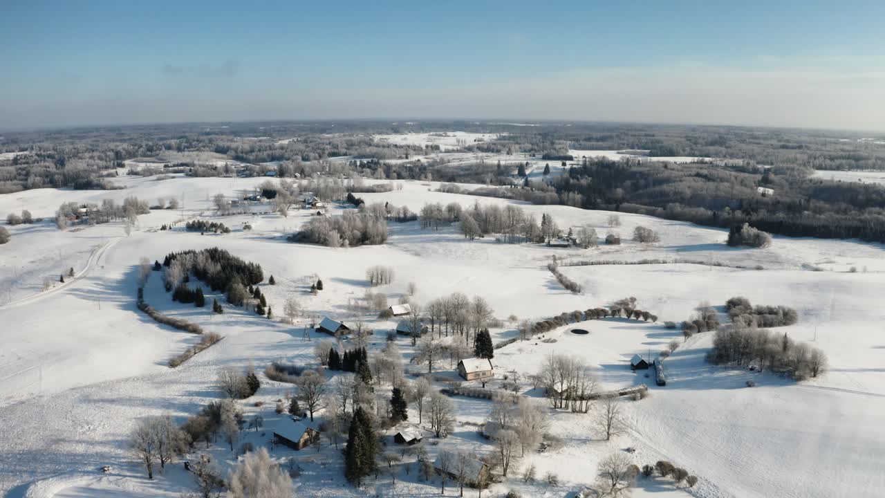 Stunning aerial panoramic view of suburban living on a sunny, snow-covered winter morning with hoar frost on trees in a charming countryside community.