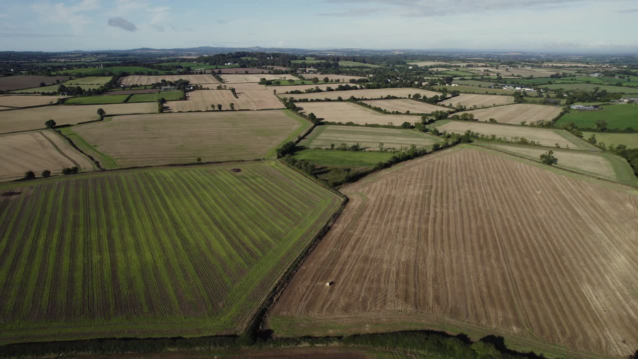 Daytime drone flight over Irish fields, showing the landscape
