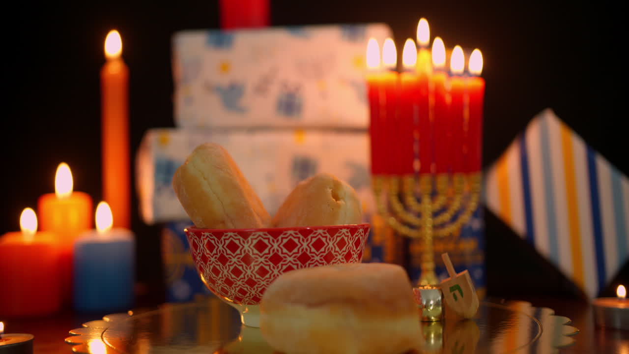 Hanukkah Celebration with Lit Menorah, Sufganiyot, and Gifts