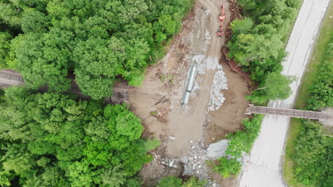 Top-Down-Drone-View:-Erosion-Caused-Gap-Disrupts-Railroad-Tracks-in-Ludlow,-VT,-Post-2023-Flooding