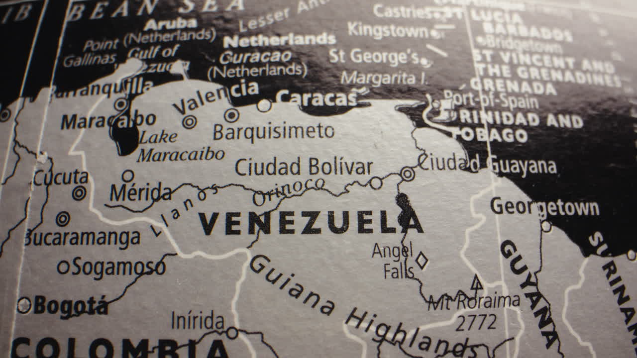 Close-up view of a world globe, focusing on Venezuela and surrounding South American countries