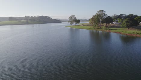 Picturesque-Lake-Surrounded-By-Lush-Green-Trees-And-Beautiful-Gardens