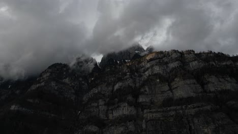 flying close to rocky mountains on walensee unterterzen lake in switzerlan