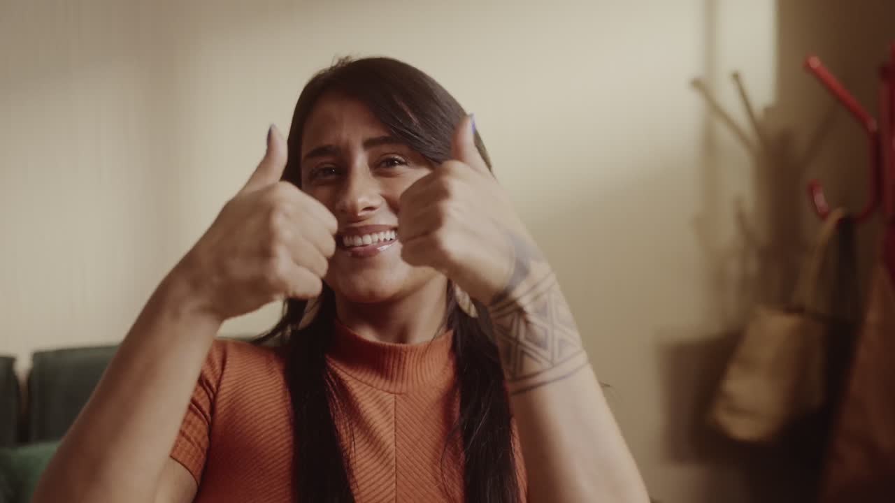 Woman giving two thumbs up