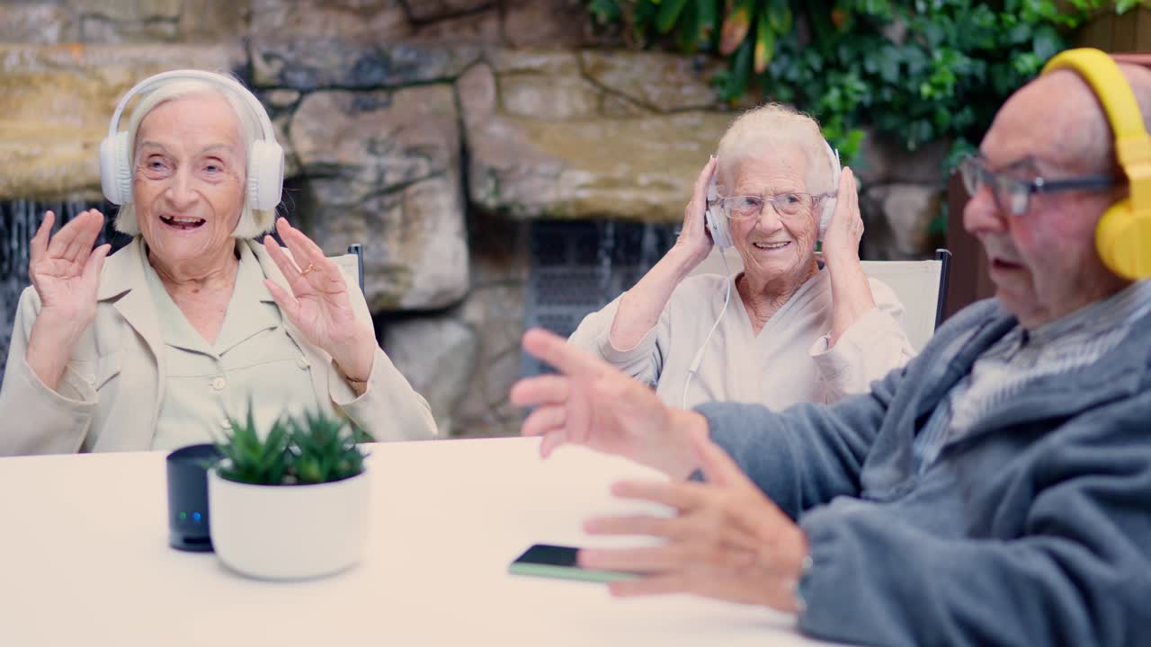 Elderly people enjoying music with headphones