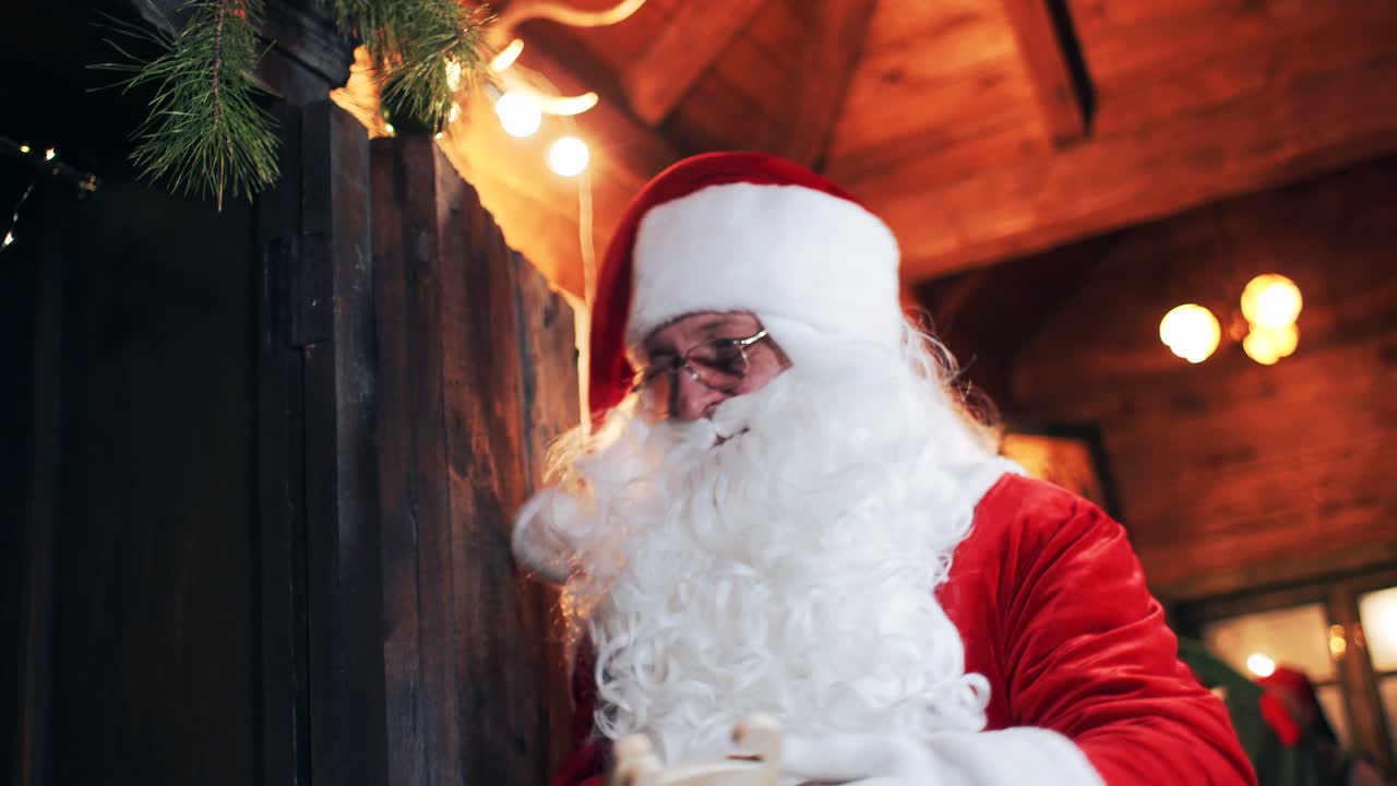 little girl gives Santa Claus a New Year's toy horse