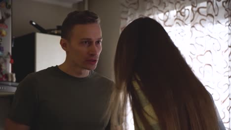 couple arguing in kitchen