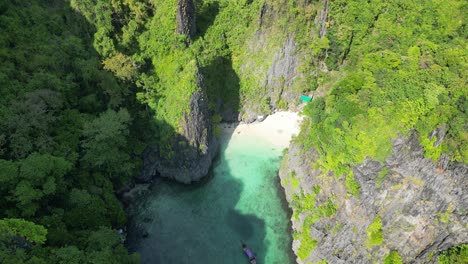 Small-Beach-shelter-hidden-at-Wang-long-Lagoon-in-Phi-phi-thailand,-Aerial