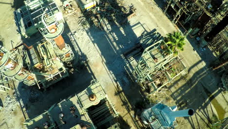 Aerial-looking-down-a-smokestack-over-an-abandoned-oil-refinery-2